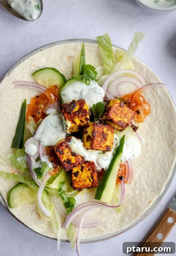 Over 50 Irresistible Paneer Recipes 11 Spiced Paneer Wrap in Plate, ready for a quick meal.