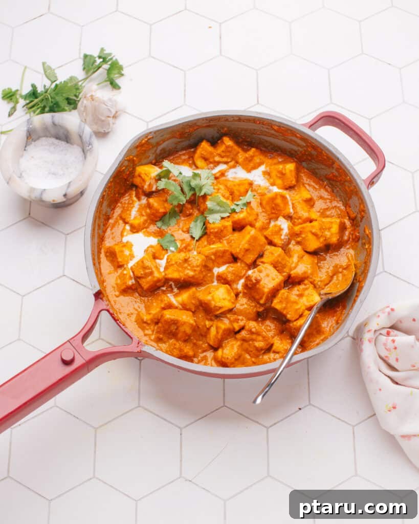 Over 50 Irresistible Paneer Recipes 4 Rich and creamy Butter Paneer in a pan, ready to serve.