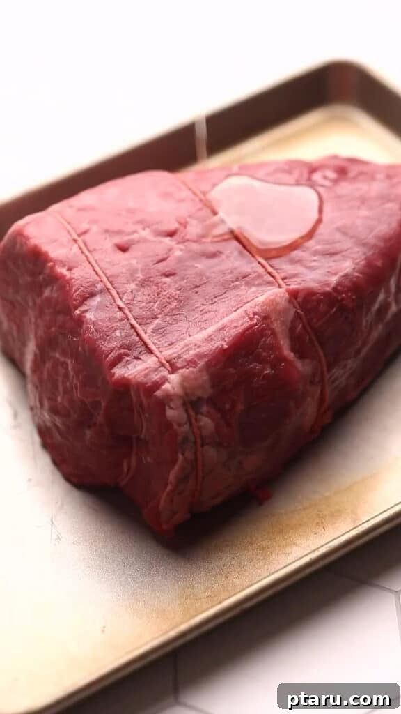 Melt in Your Mouth Air Fryer Roast Beef 3 Preparing roast beef with cooking oil