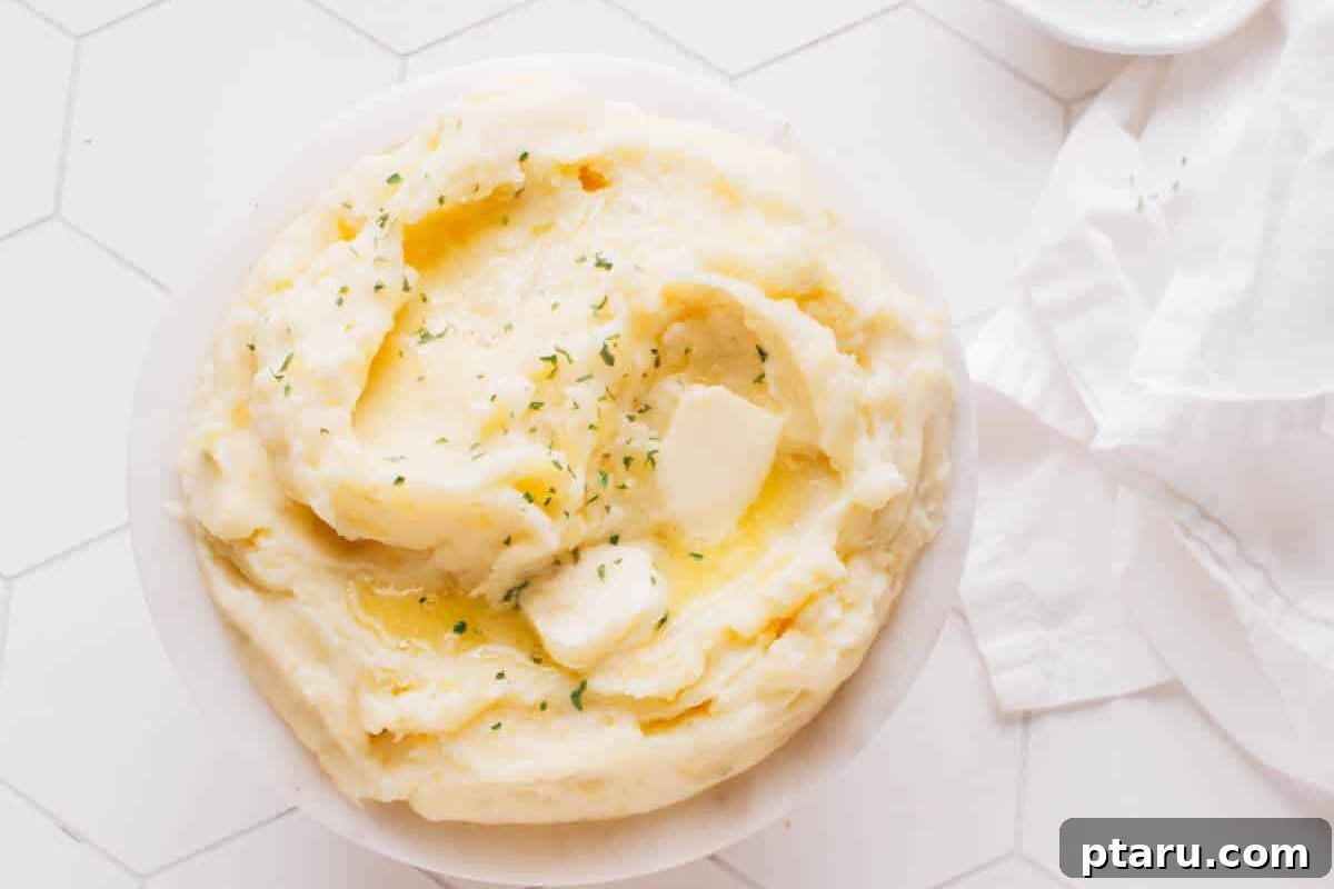 Melt in Your Mouth Air Fryer Roast Beef 9 A generous bowl of creamy mashed potatoes topped with melting butter.