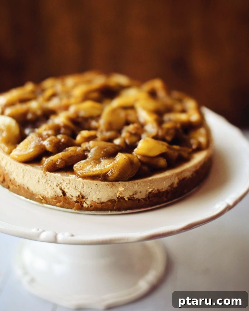 Spiced Caramel Apple Cheesecake 2 Easy Caramel Apple Cheesecake on a decorative cake stand, ready to be served.