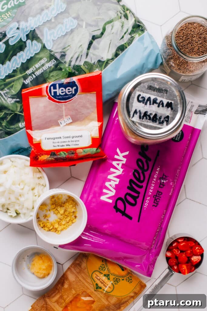 Creamy Spinach Paneer 4 Fresh ingredients for Palak Paneer laid out on a table