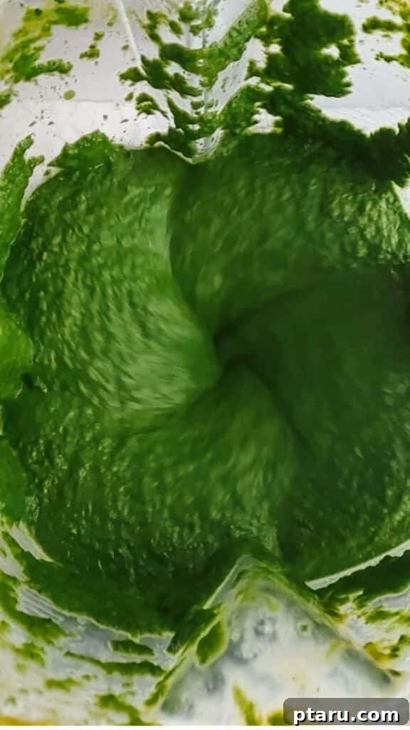Creamy Spinach Paneer 8 Spinach and spice mixture being blended for a smooth Palak Paneer sauce