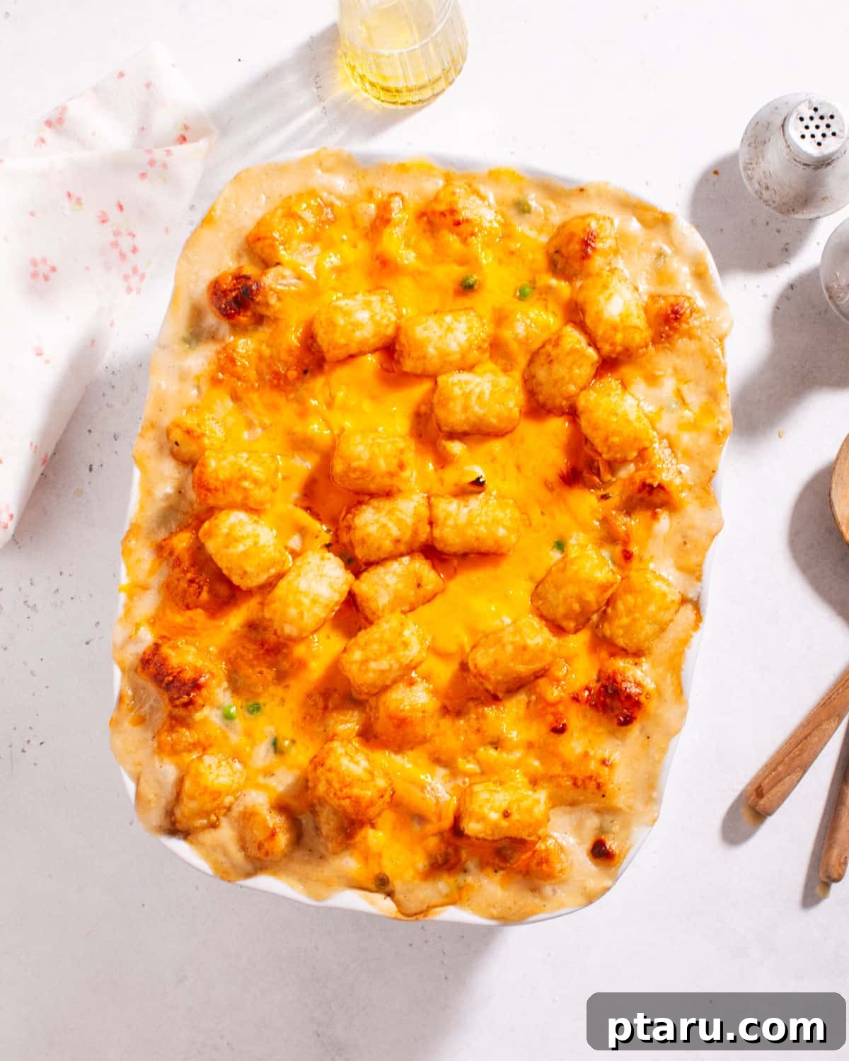 Cozy Winter Comfort: 33 Hearty Casserole Creations 11 Golden Chicken and Potato Casserole, topped with crispy tater tots.