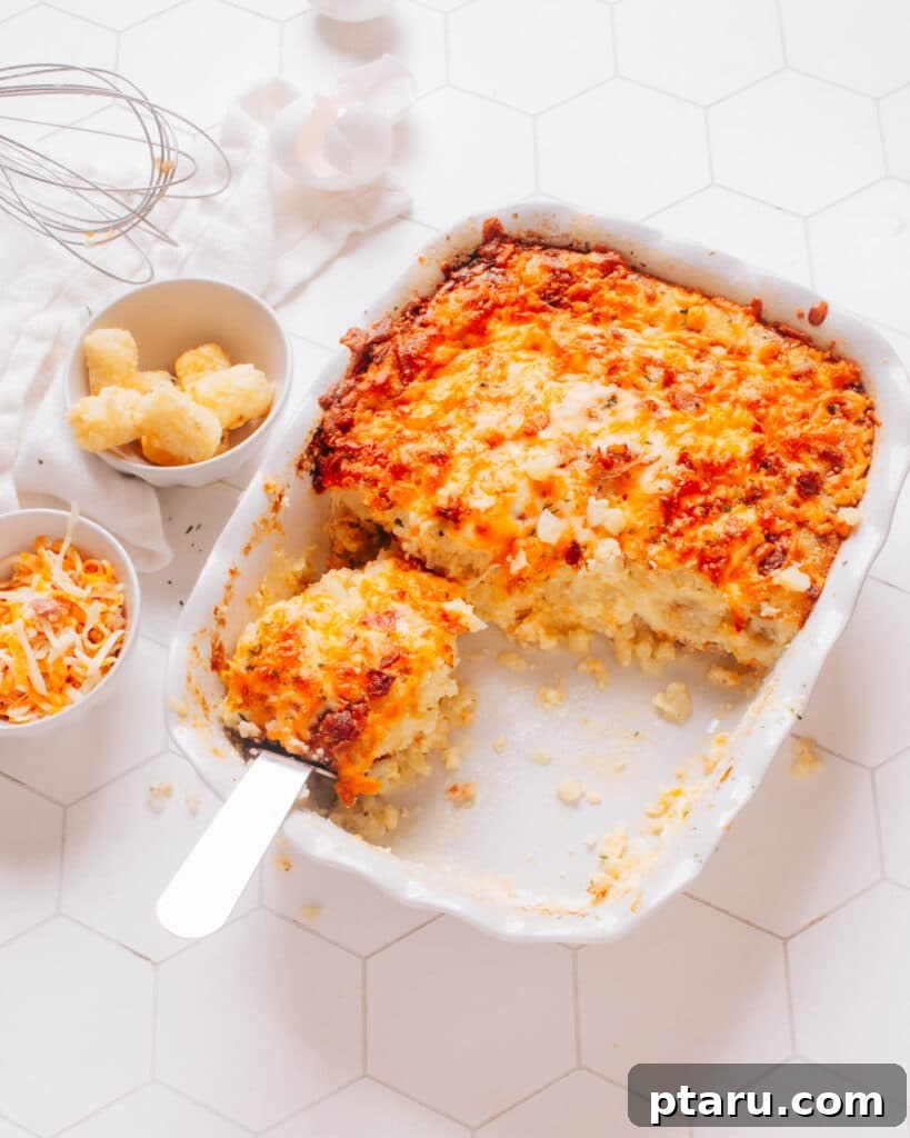 Cozy Winter Comfort: 33 Hearty Casserole Creations 14 Hearty Tater Tot Breakfast Casserole with golden crispy tots and cheesy eggs.
