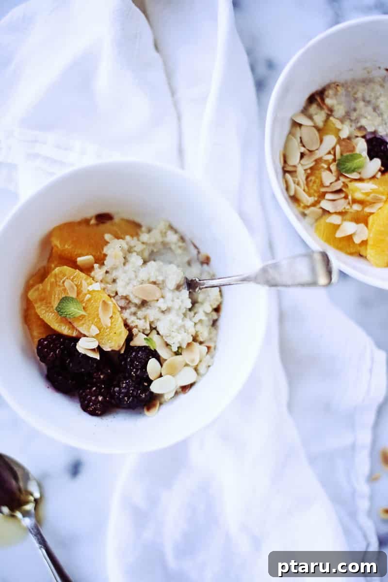 Nourishing Quinoa Power Bowl 2 A person holding a cozy bowl of creamy breakfast porridge, symbolizing a mindful and comforting start to a busy day.