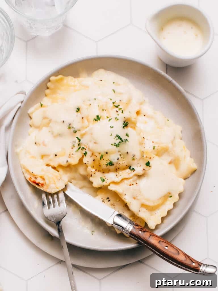 The Perfect Cook Time for Fresh Ravioli 2 Lobster ravioli on a plate with sauce and snipped chives, perfectly cooked and glistening.