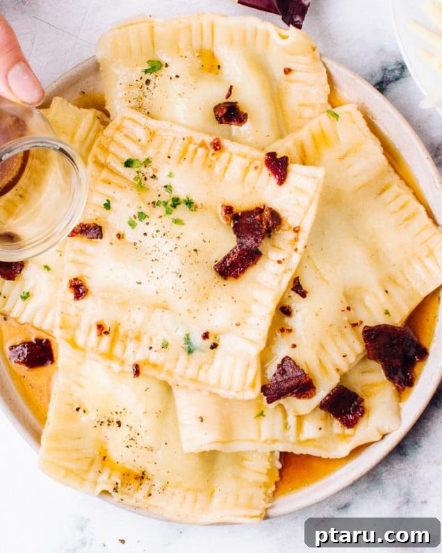 The Perfect Cook Time for Fresh Ravioli 5 Pouring browned butter over fresh homemade ravioli on a serving dish.
