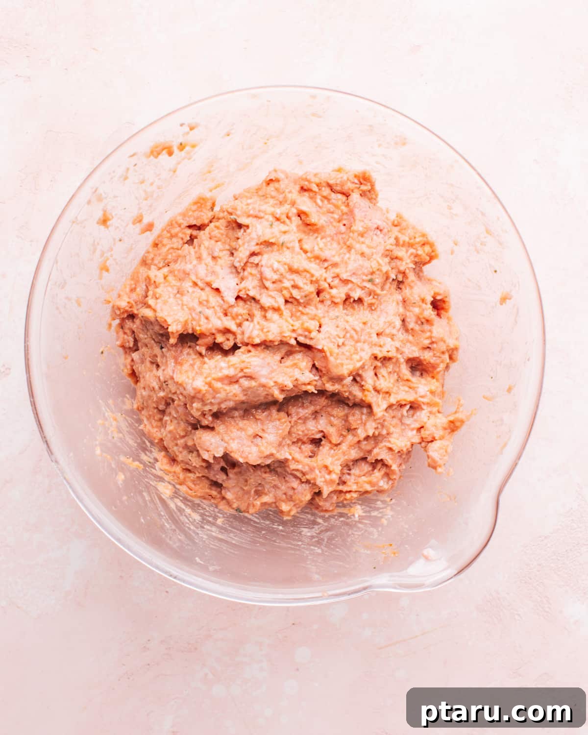The Ultimate Juicy Turkey Meatloaf 4 A large mixing bowl filled with the seasoned ground turkey meatloaf mixture, ready for shaping.