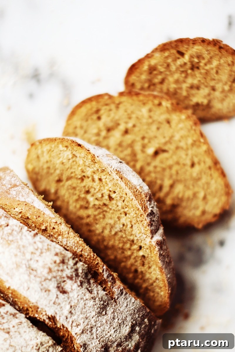 Hearty Oat & Whole Wheat Loaf 8 Two slices of Oatmeal Brown Bread spread with butter and marmalade.