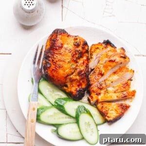 Air Fryer Frozen Chicken Breast: Effortlessly Tender and Juicy 10 Air Fryer Frozen Chicken Breast sliced on a plate with cucumbers.