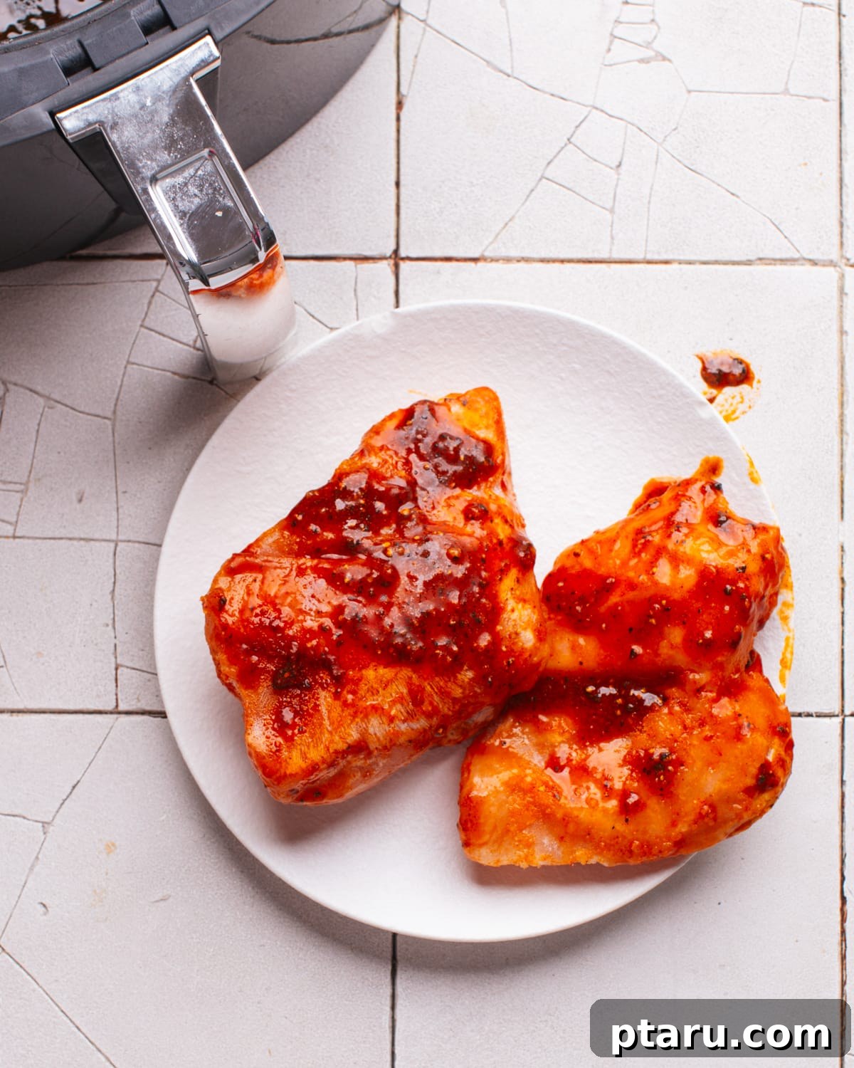 Air Fryer Frozen Chicken Breast: Effortlessly Tender and Juicy 5 Spice coating on frozen chicken to put in air fryer.