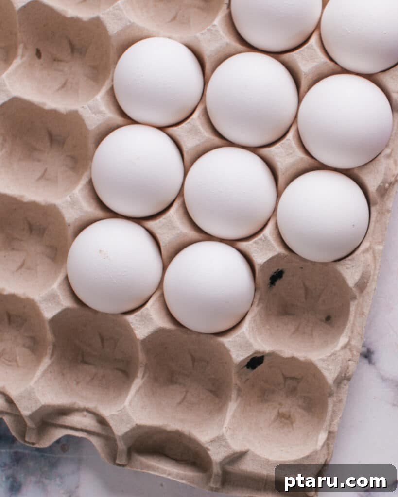 Foolproof Over Medium Eggs 3 Fresh eggs in a carton, symbolizing quality ingredients.
