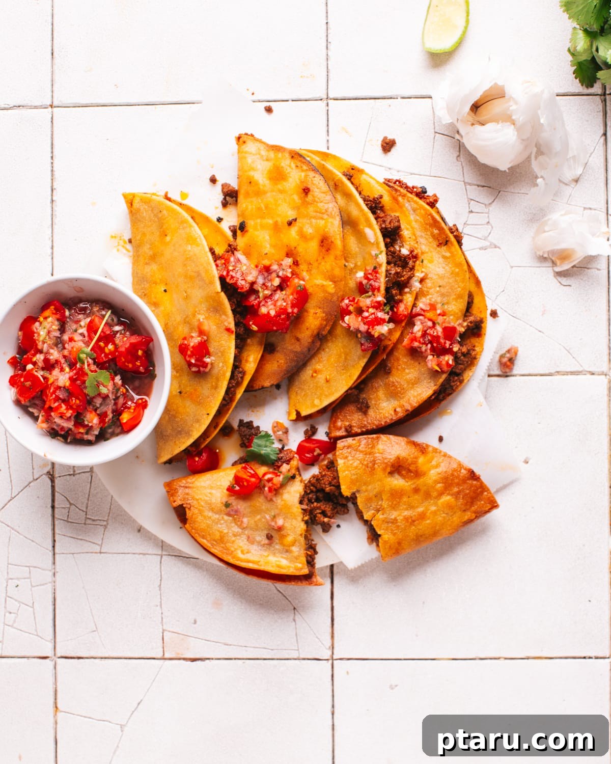 Crispy Fried Tacos Made Easy 2 A plate of golden-brown fried tacos, garnished with fresh cilantro and a side of vibrant taco salsa, ready to be enjoyed.