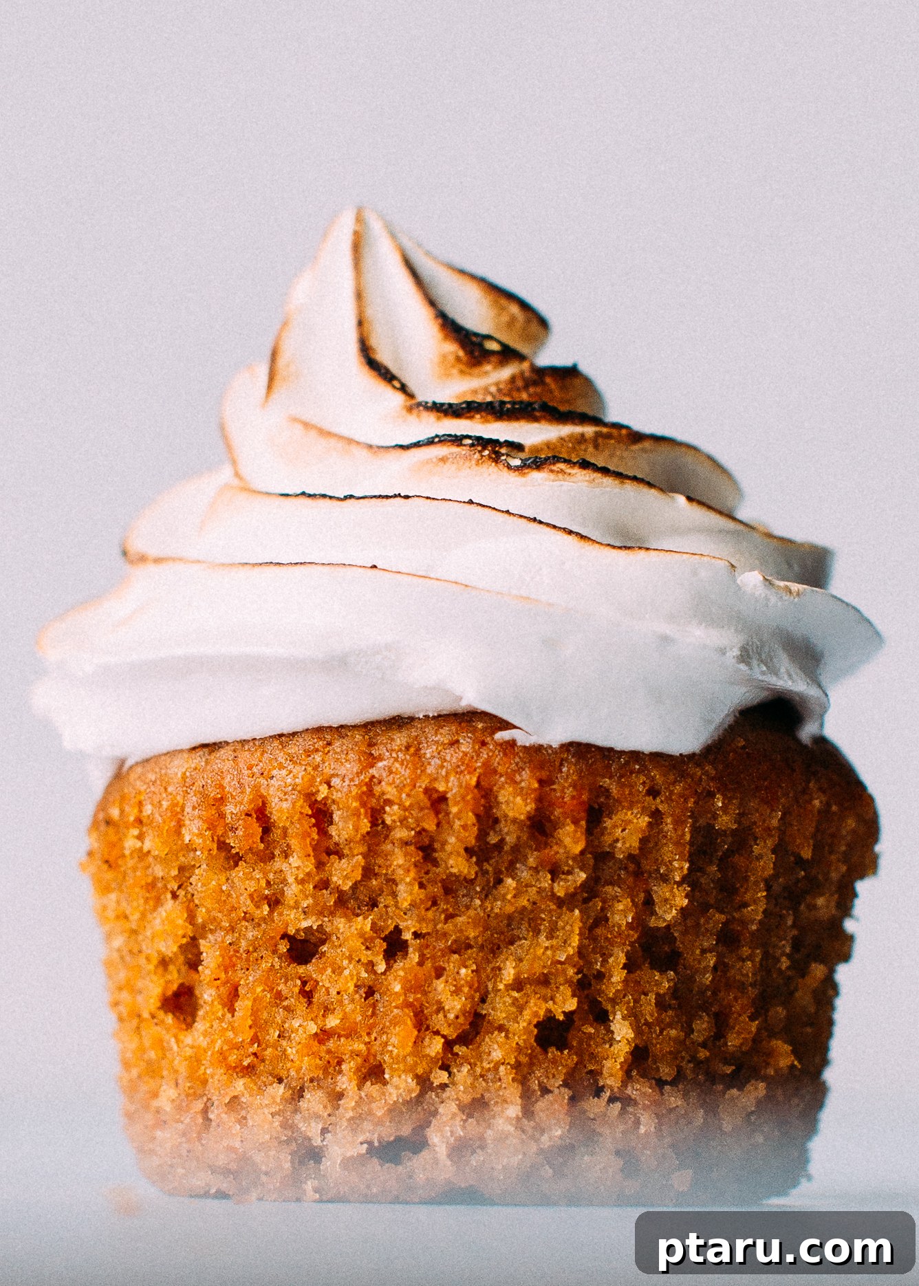 Golden Torched Marshmallow Sweet Potato Cupcakes 2 A beautifully frosted sweet potato cupcake, ready to be enjoyed.
