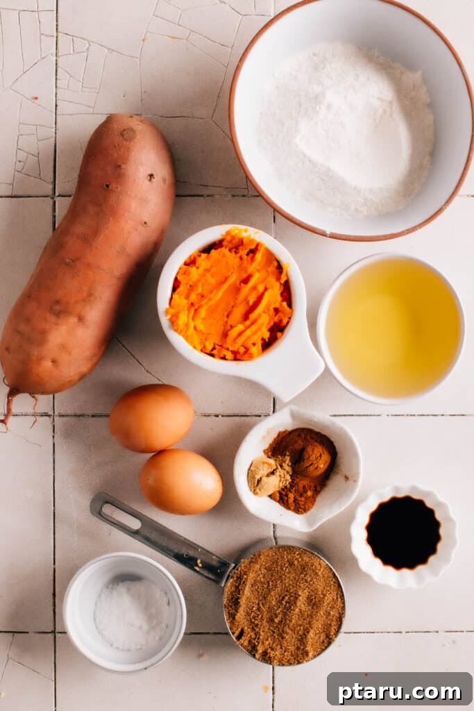 Golden Torched Marshmallow Sweet Potato Cupcakes 4 Ingredients for sweet potato cupcakes laid out on a kitchen counter, showcasing fresh orange sweet potatoes.