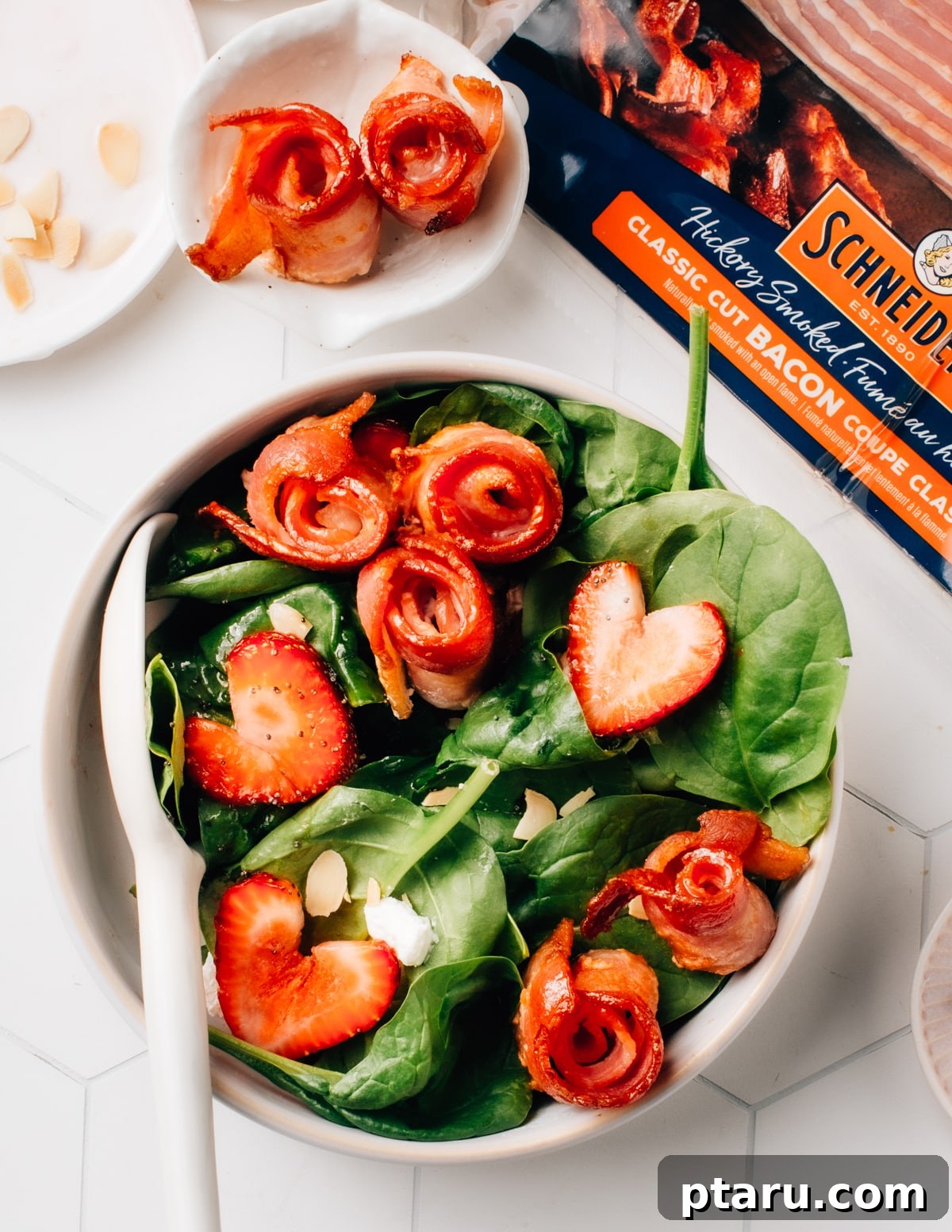 Mastering Big Batch Crispy Bacon in Your Air Fryer 2 Crispy air fryer bacon on top of a fresh spinach salad with vibrant strawberries. A delicious and healthy way to enjoy air fried bacon.