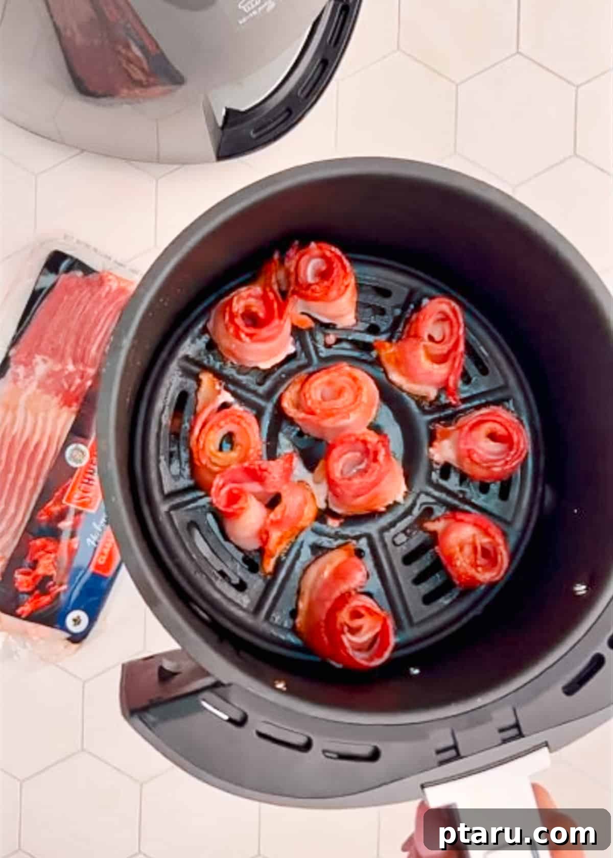 Mastering Big Batch Crispy Bacon in Your Air Fryer 4 Perfectly air fried bacon strips neatly arranged in an air fryer basket, ready to be served.