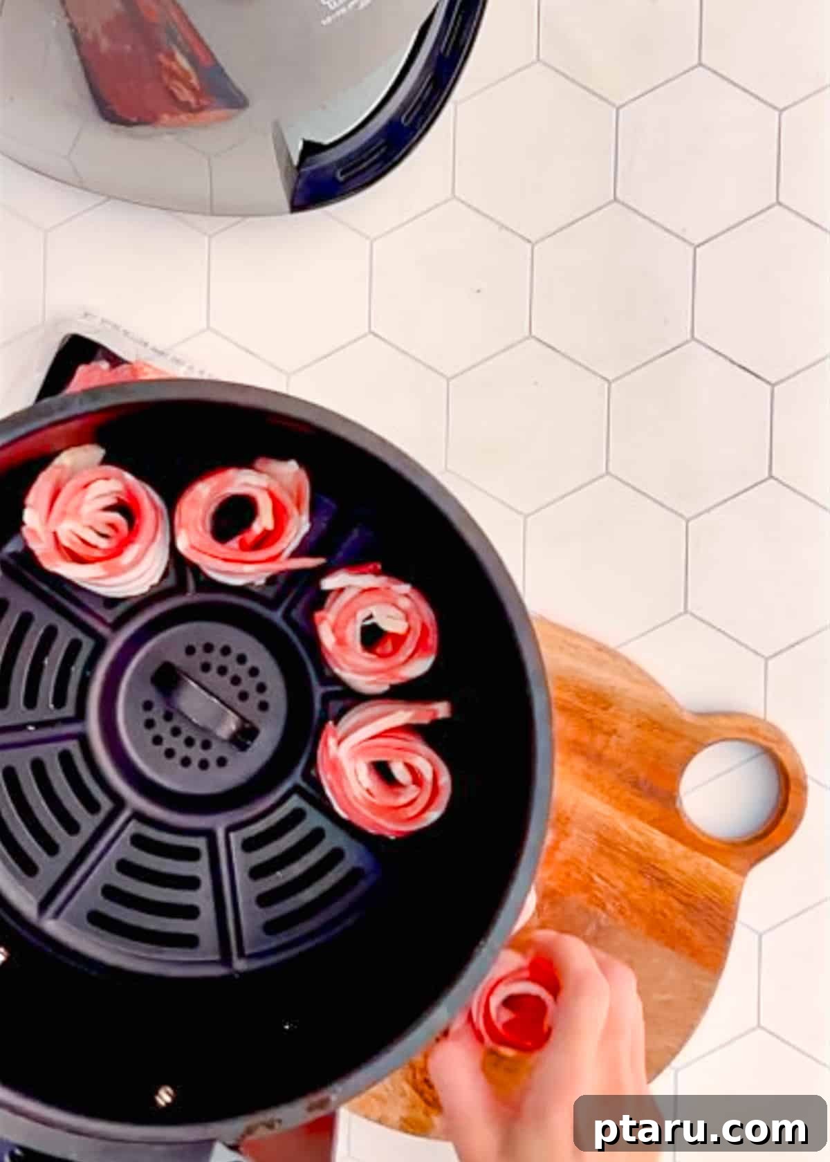 Mastering Big Batch Crispy Bacon in Your Air Fryer 5 Carefully adding rolled bacon rosettes into the air fryer basket, ensuring proper spacing for even cooking.