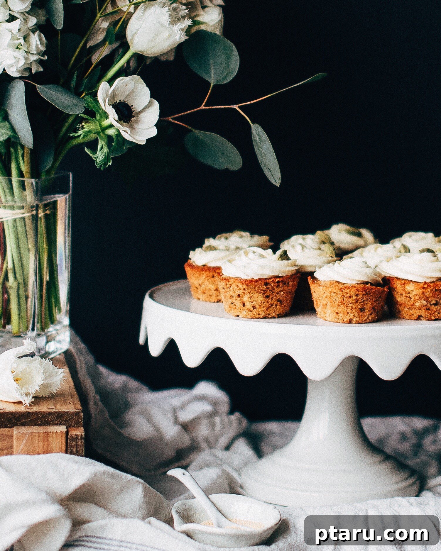 Richly Spiced Parsnip Cupcakes with Velvety Cream Cheese Frosting 2 A beautifully presented spiced parsnip cupcake with a generous swirl of cream cheese frosting, hinting at its deliciousness.