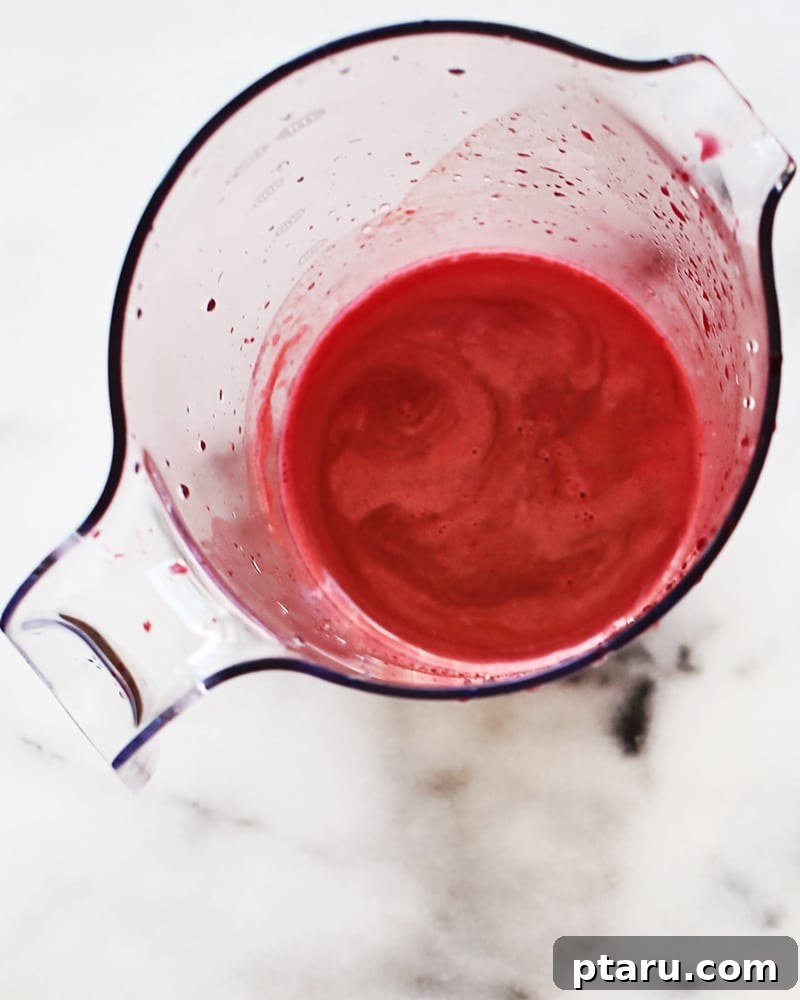 Essential Apple Beet Carrot Nectar 3 Various fruits and vegetables, including apples, beets, and carrots, ready for juicing
