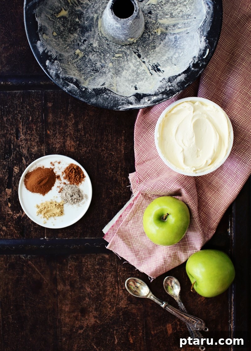 Chai Kissed Apple Cake with Creamy Frosting 3 Ingredients for chai apple cake laid out on a counter.