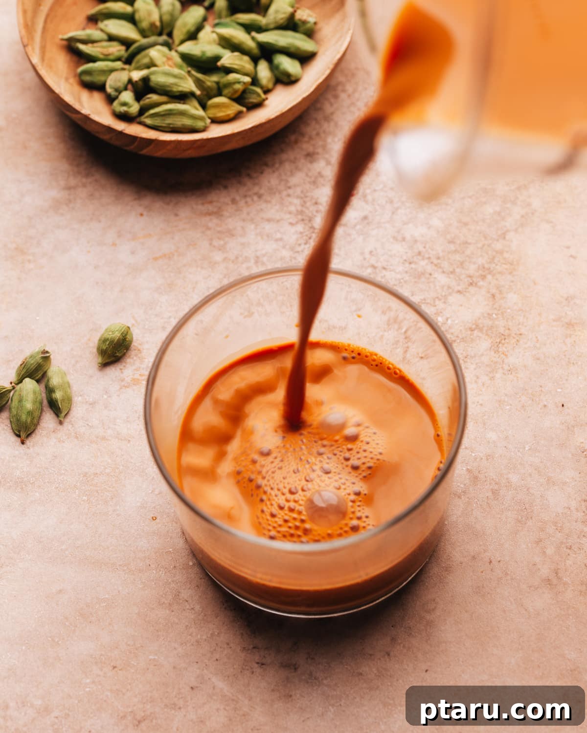 The Ultimate Butter Chicken Recipe: Restaurant-Level Perfection at Home 13 Hot chai being poured into a glass.
