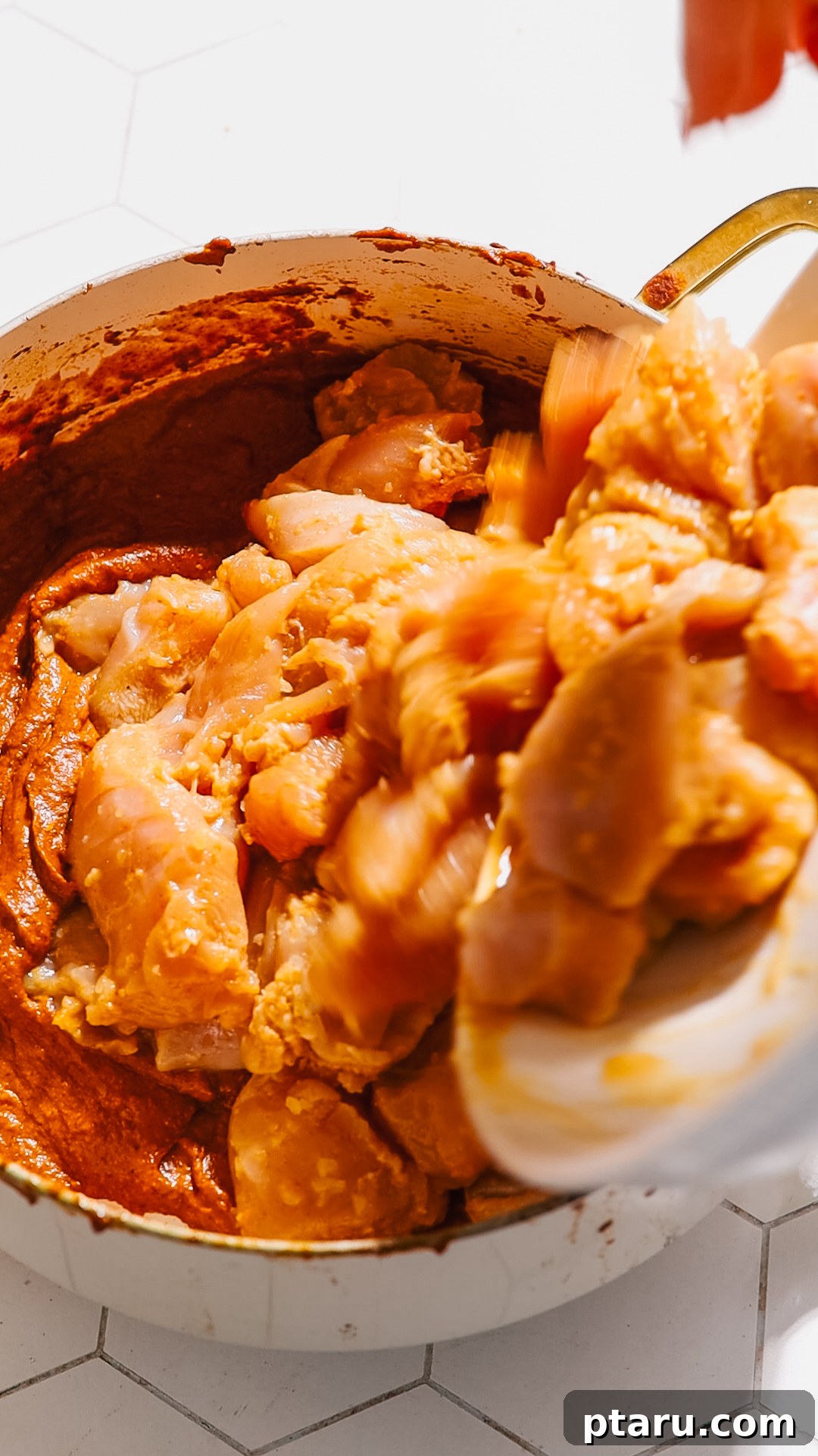 The Ultimate Butter Chicken Recipe: Restaurant-Level Perfection at Home 8 Adding the marinated chicken to butter chicken sauce.