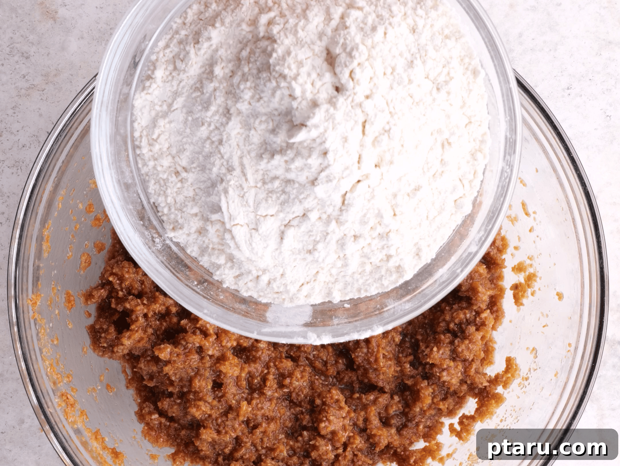 Classic Moist Blueberry Bran Muffins 3 The process of making blueberry bran muffins, showing ingredients being mixed.