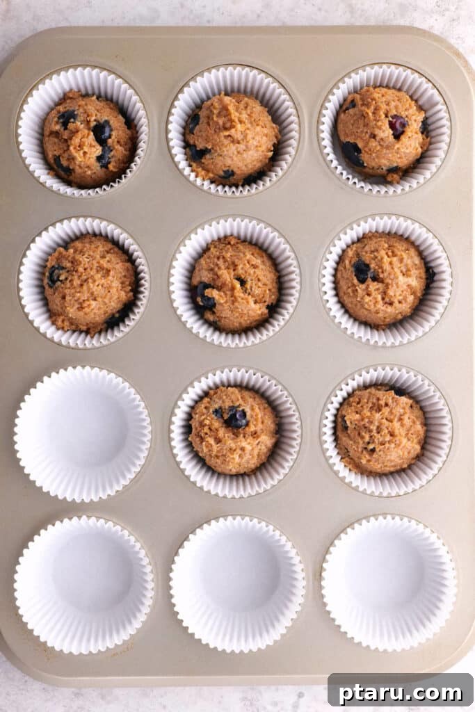 Classic Moist Blueberry Bran Muffins 5 Blueberry bran muffins recipe batter in muffin cups, ready for baking.