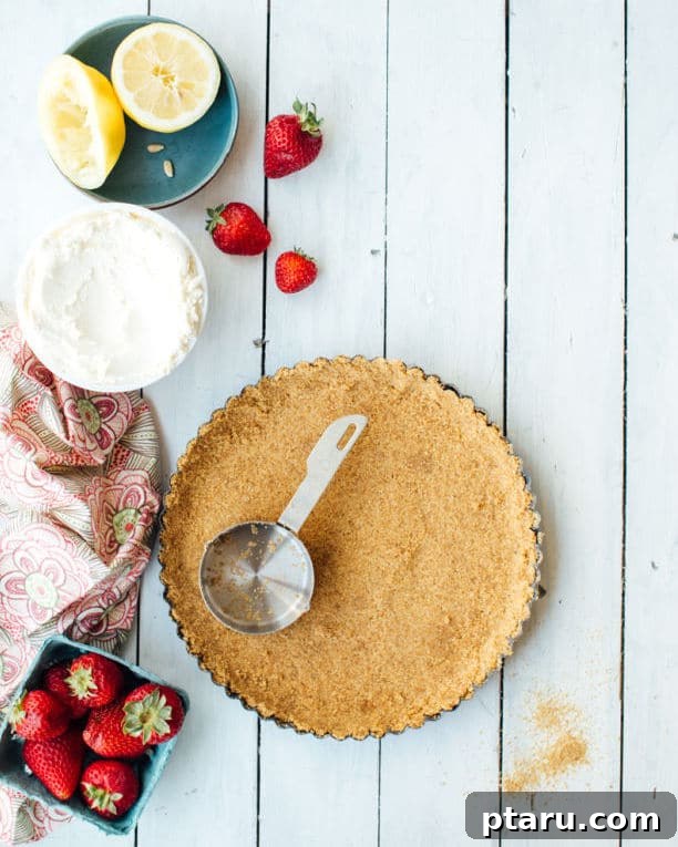 Strawberry Lemon Mascarpone Dream Tart 3 A close-up shot of the Strawberry-Lemon Mascarpone Cream Tart, highlighting the smooth texture of the cream and the juicy strawberries.