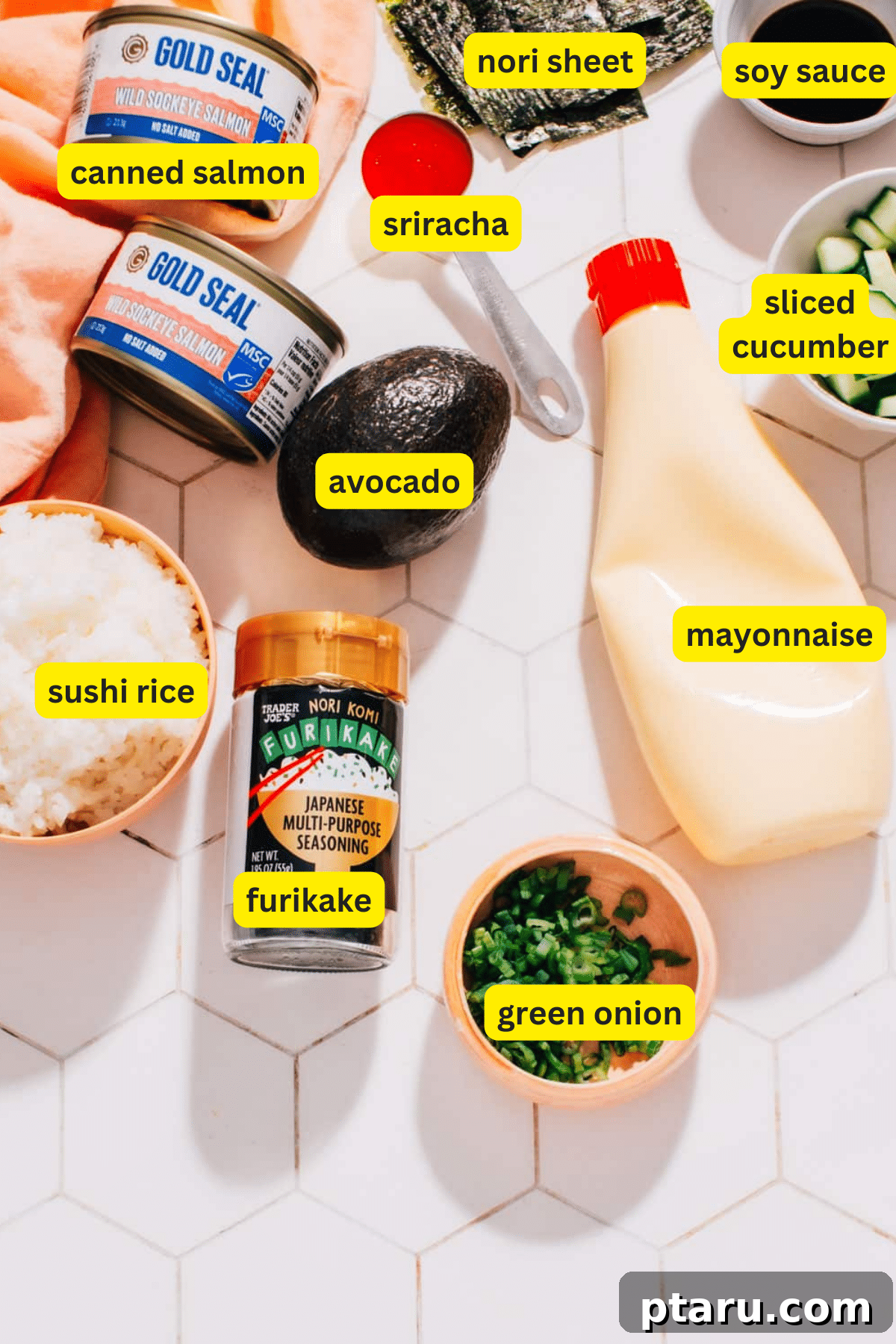 Baked Salmon Sushi Cups 3 A flat lay image showing all the ingredients required for baked salmon rice muffins, including rice, canned salmon, mayonnaise, sriracha, soy sauce, nori, and spices.