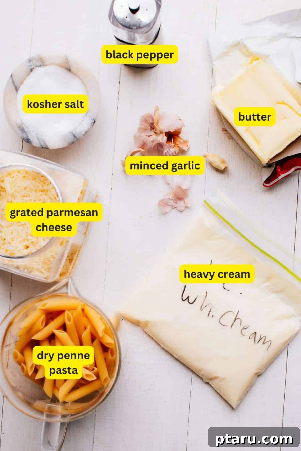 The Easy Penne Alfredo You'll Make Every Week 3 Ingredients for Alfredo Sauce with Penne Pasta laid out on a table.