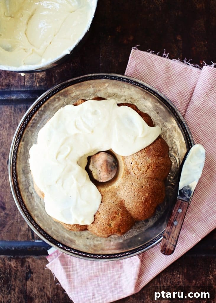 Easy Indian Desserts and Sweets: Crowd-Pleasing Showstoppers 7 A slice of warm Chai Apple Cake with mascarpone frosting, infused with aromatic chai spices.
