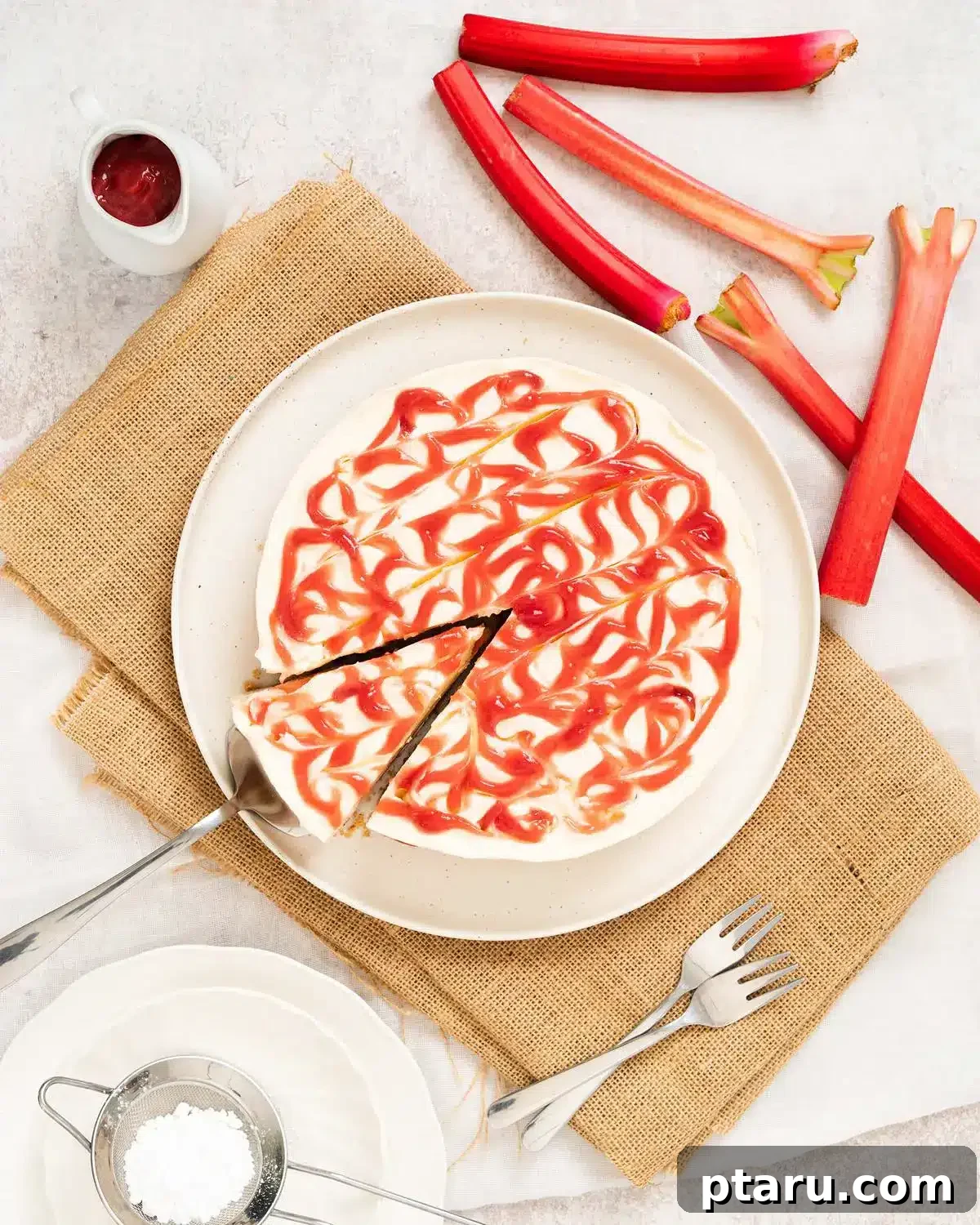 Favorite Easy Rhubarb Recipes You'll Make Forever 16 A slice of No Bake Rhubarb Cheesecake with a fruit topping.