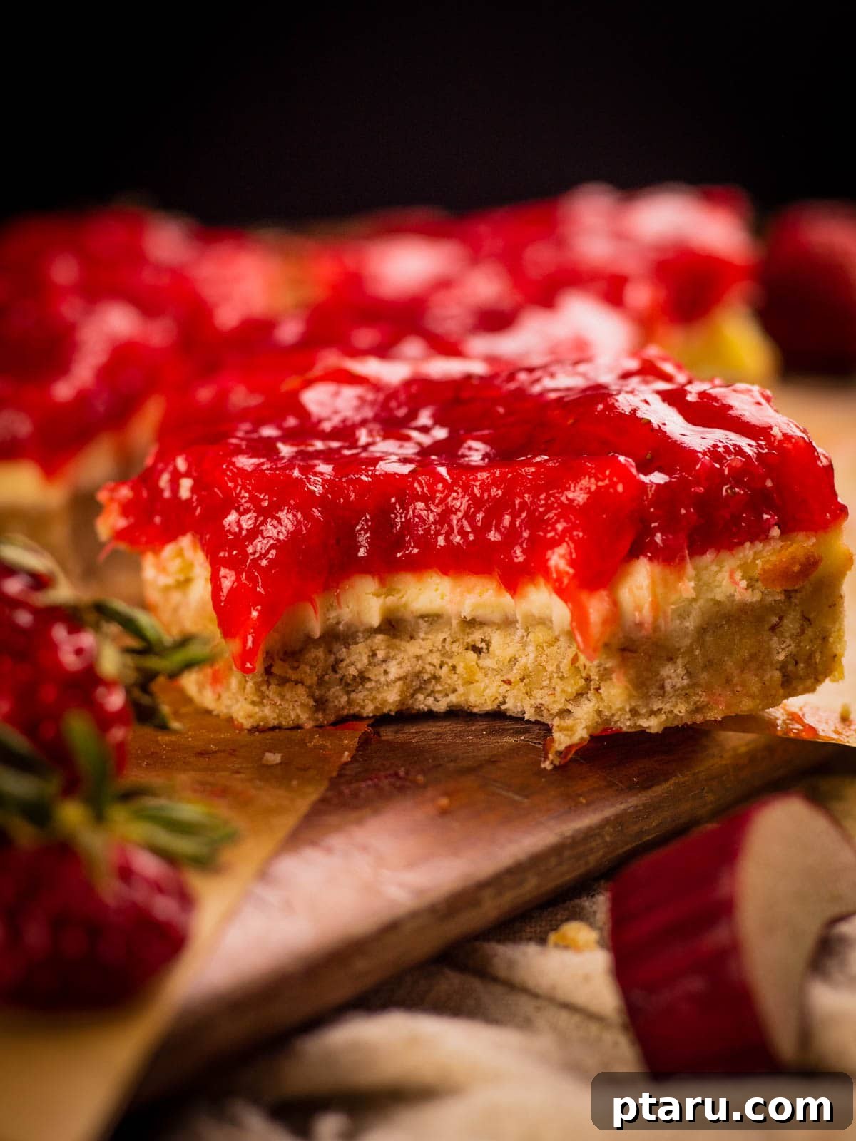 Favorite Easy Rhubarb Recipes You'll Make Forever 17 Strawberry Rhubarb Cheesecake Bars cut into squares.
