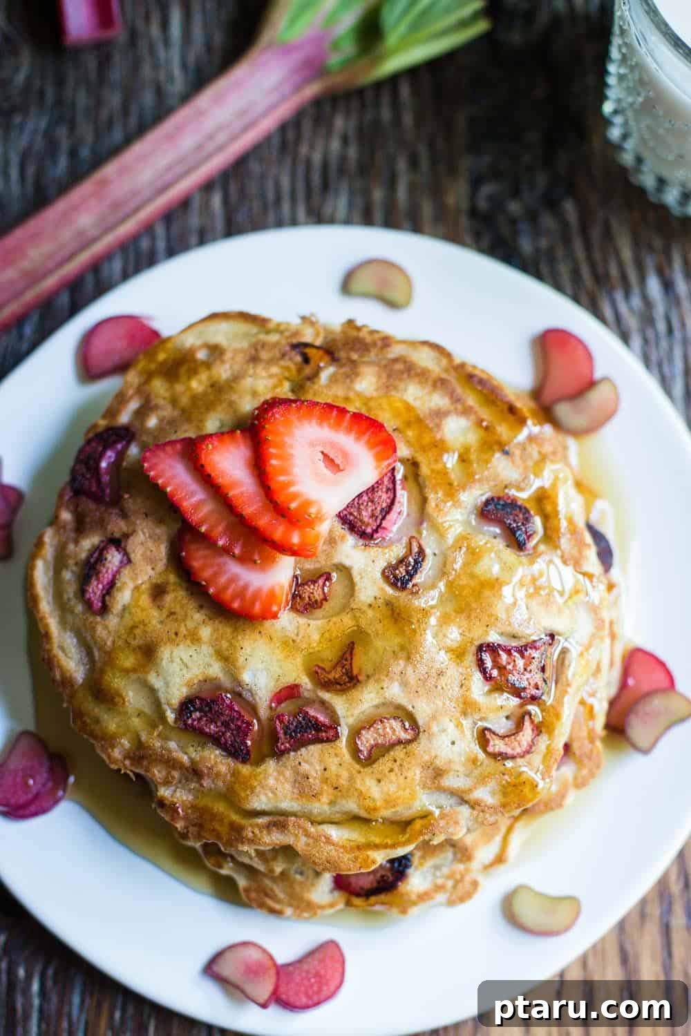 Favorite Easy Rhubarb Recipes You'll Make Forever 24 A stack of golden brown Rhubarb Pancakes with diced rhubarb.