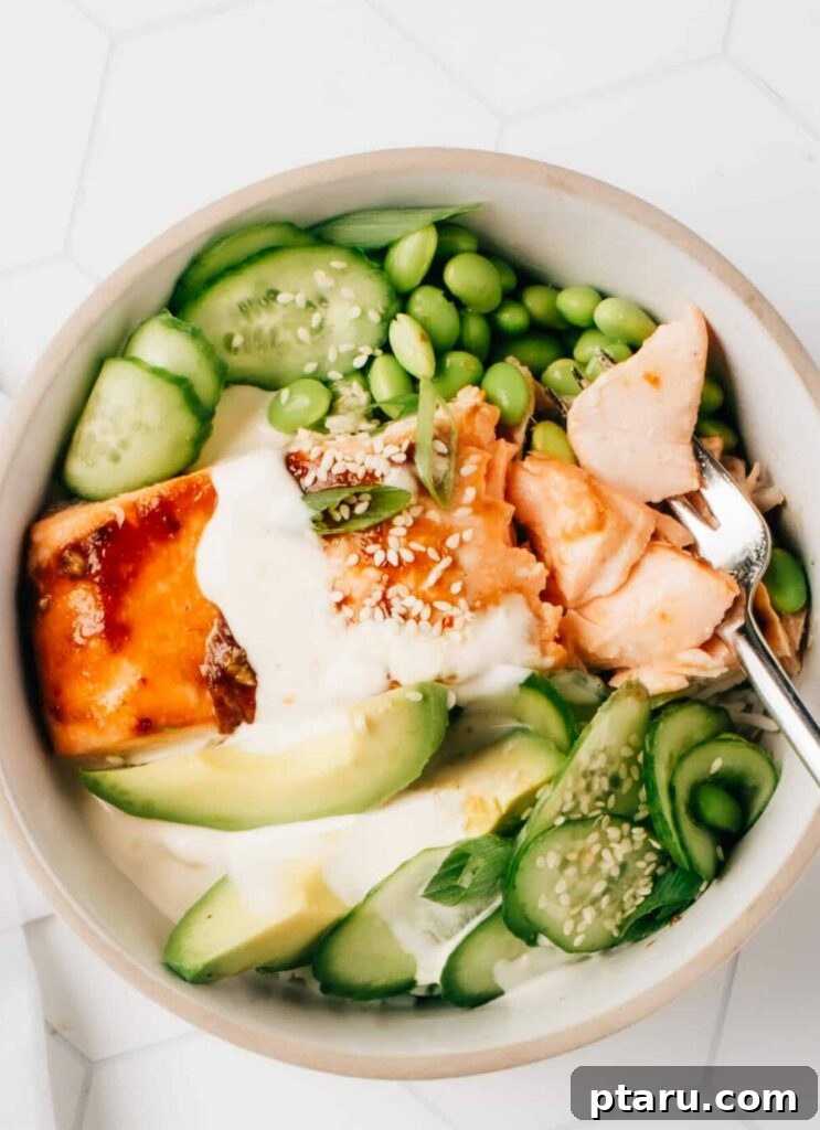 Your Ultimate Guide to Salmon Side Dishes 2 Honey Teriyaki Salmon Bowl with green vegetables and sauce, a perfect example of a delicious salmon meal.