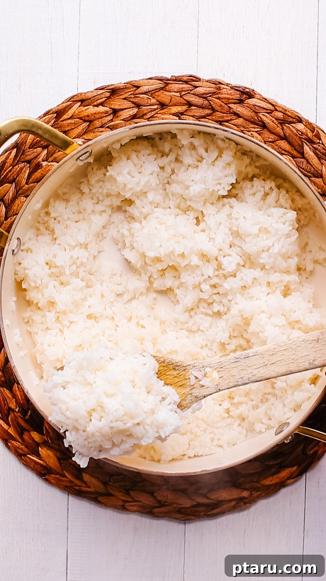 Your Ultimate Guide to Salmon Side Dishes 15 Fluffy Sushi Rice with a spoon, ready to be served.