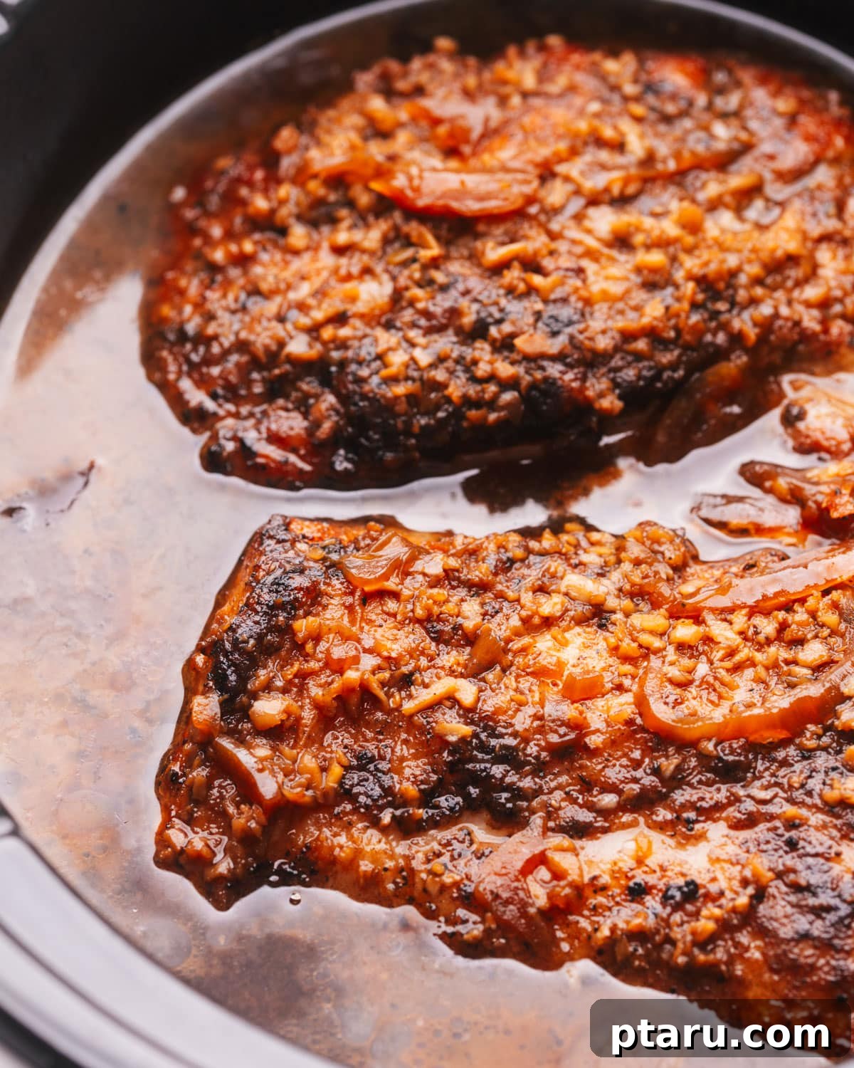 Fork Tender Slow Cooker Pork Loin 9 A perfectly cooked pork loin resting in a slow cooker.