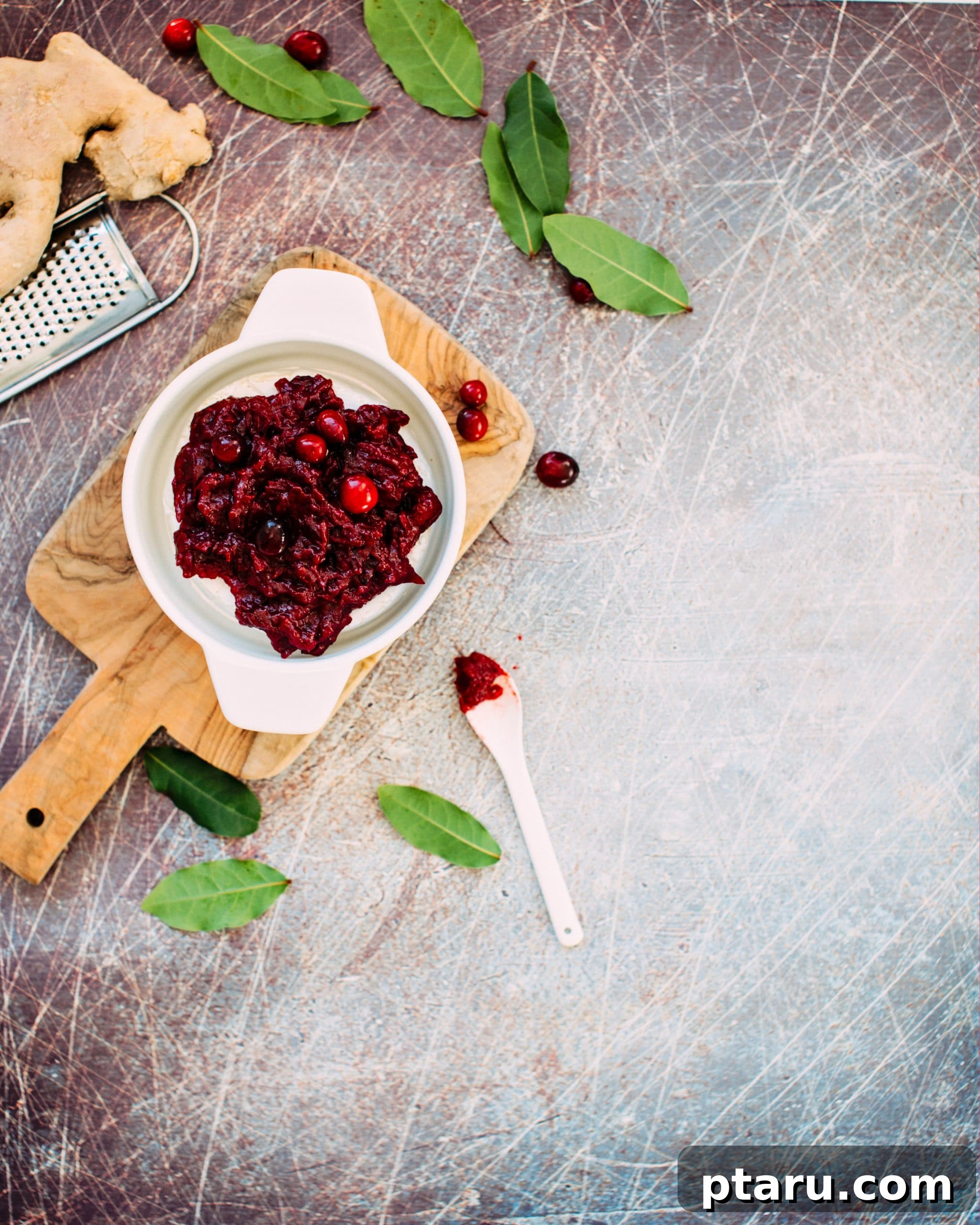 Warm Brie with Zesty Cranberry-Ginger Chutney 3 Ingredients for Cranberry Ginger Chutney being simmered in a saucepan