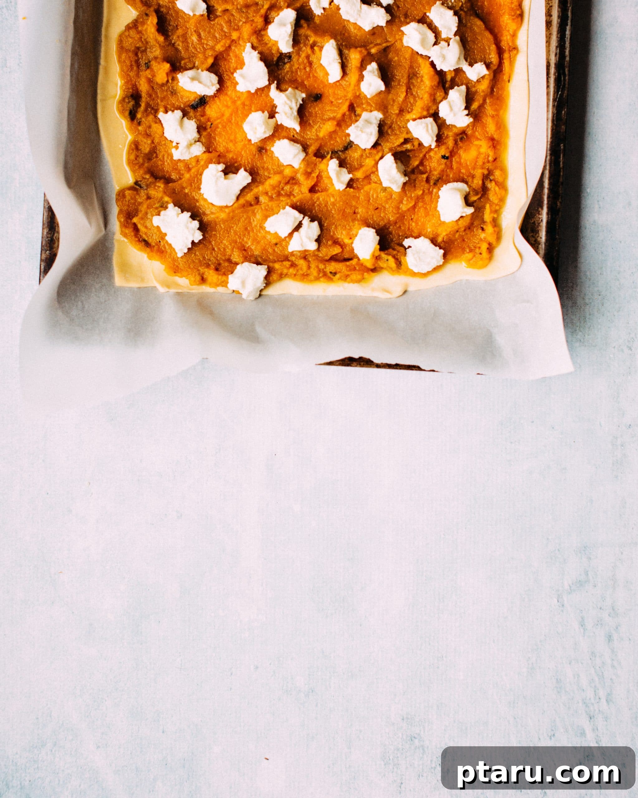 Easy Savory Squash Tart with Roasted Garlic and Goat Cheese 3 A beautiful plate of Roasted Squash, Garlic + Goat Cheese Tart, garnished with chives