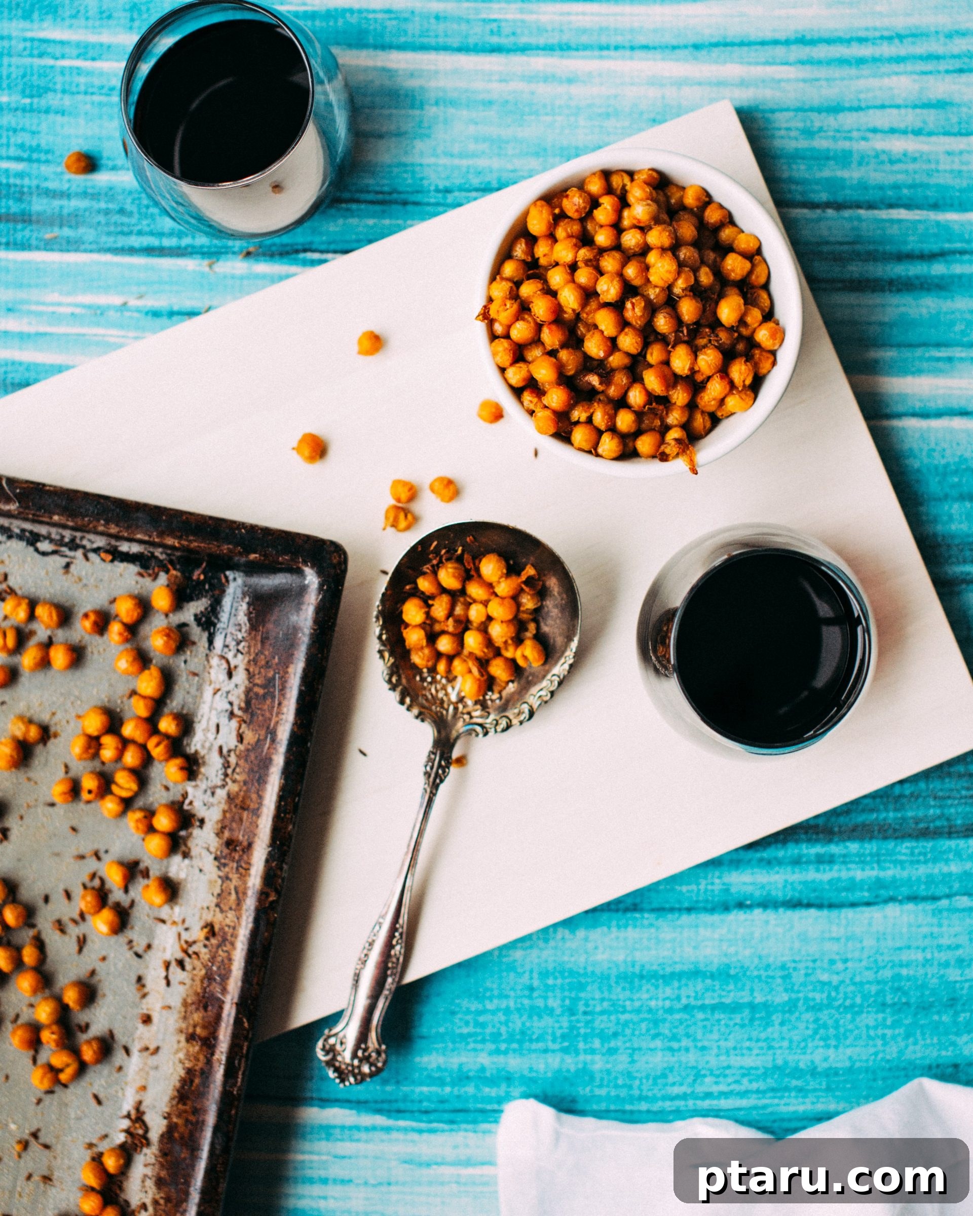 Zesty Chickpea Crunch 2 Crispy Spiced Roasted Chickpeas in a serving bowl, garnished with fresh herbs.
