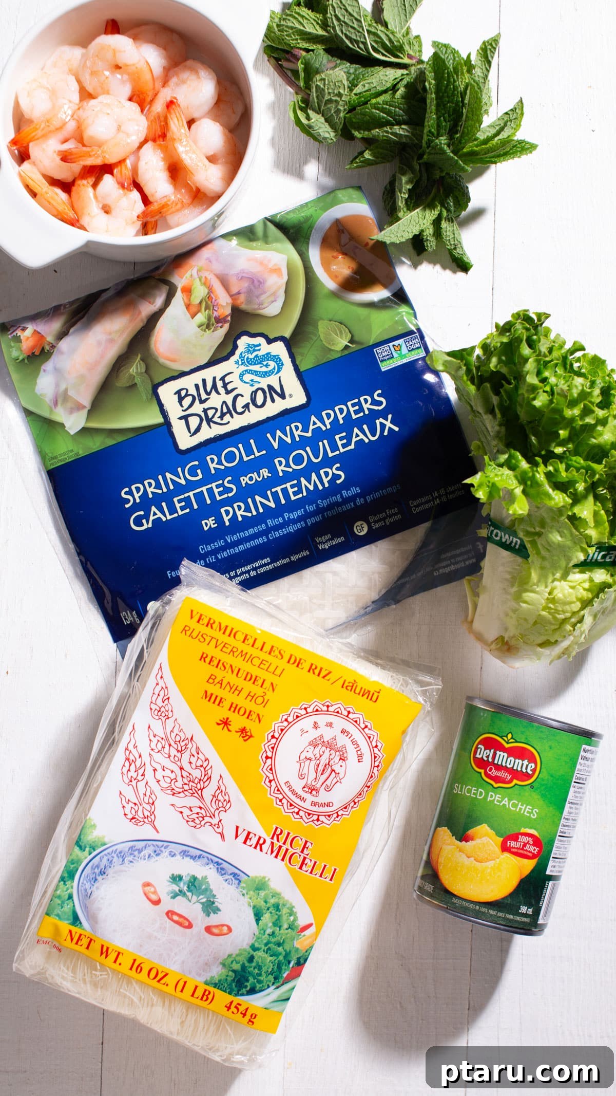 Fresh and Easy Homemade Spring Rolls 4 Various fresh ingredients for spring rolls displayed on a wooden board, highlighting customization options.