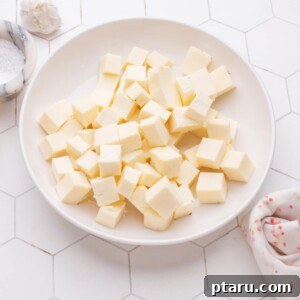 Homemade Paneer Cubes on a plate, ready for use.