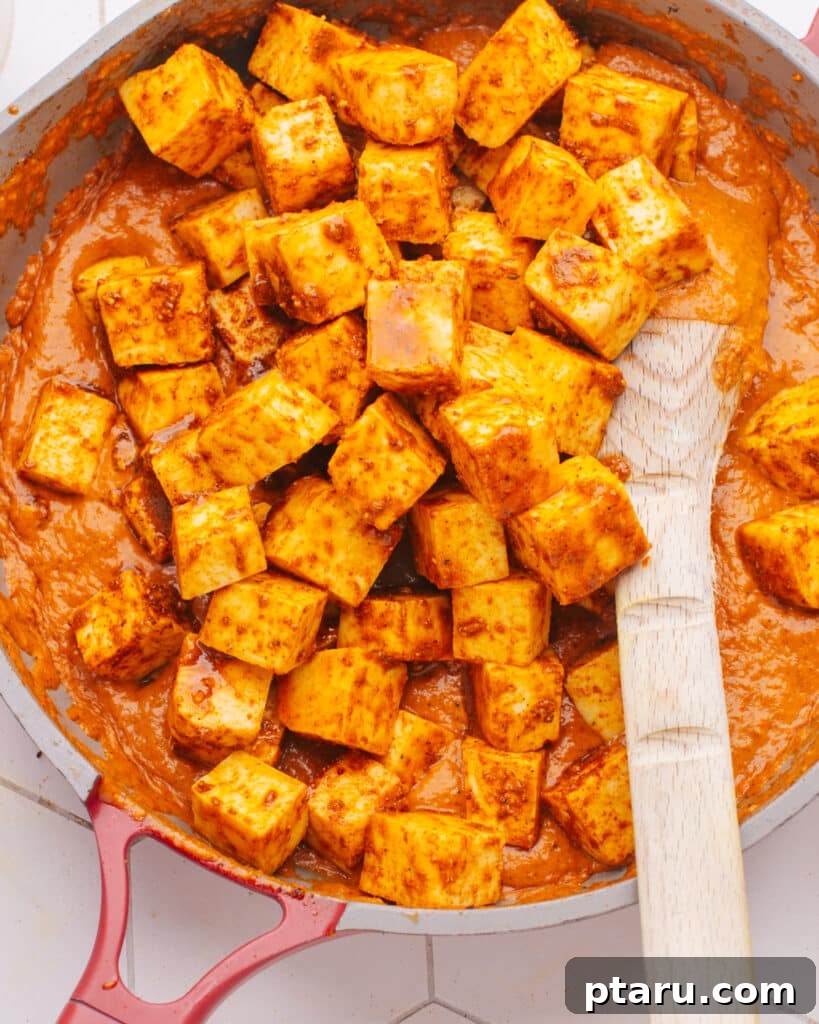 Effortless Homemade Paneer Your Step by Step Guide 3 How to Make Paneer at Home: Paneer cubes simmering in a rich, savory sauce.