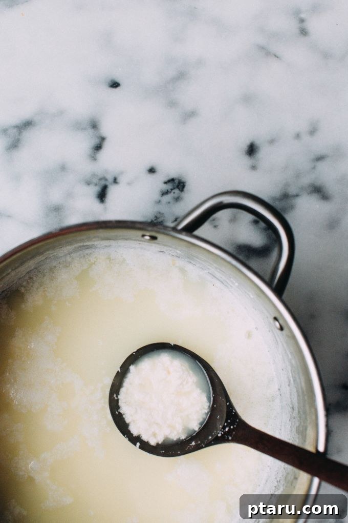 Effortless Homemade Paneer Your Step by Step Guide 6 Milk curdling with lemon juice in a pot.