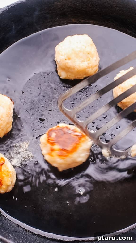 Simple Creamy Paneer Malai Kofta Curry 11 Pan-frying the paneer and potato kofta balls until golden brown.