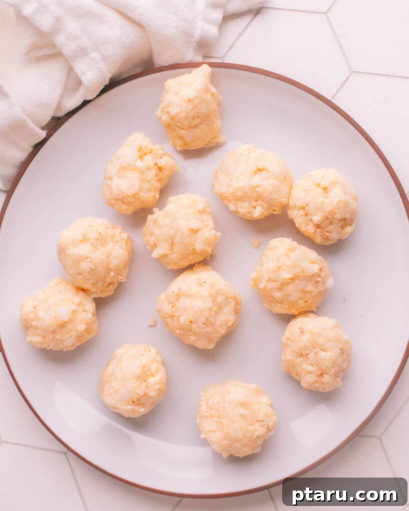 Simple Creamy Paneer Malai Kofta Curry 10 Hand-formed paneer and potato kofta balls ready for pan-frying.