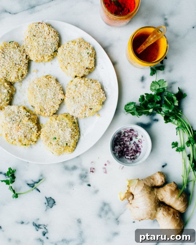 Spiced Indian Fish Fritters 3 Freshly formed fish cutlets, ready for breading and frying.